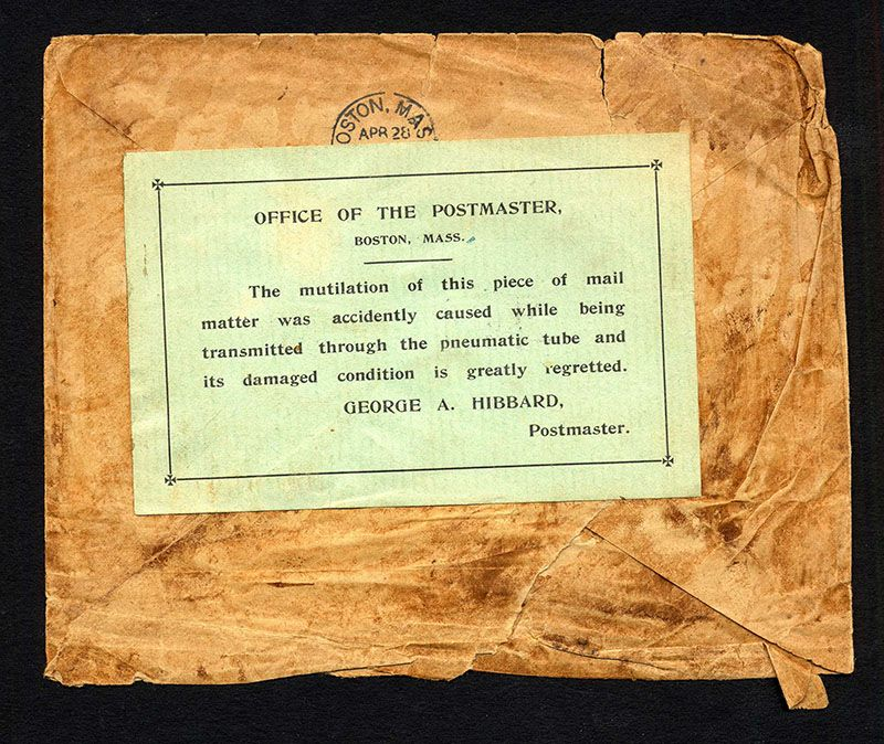 A photo of mail returned by the USPS, with a note apologizing for how it was destroyed during transit